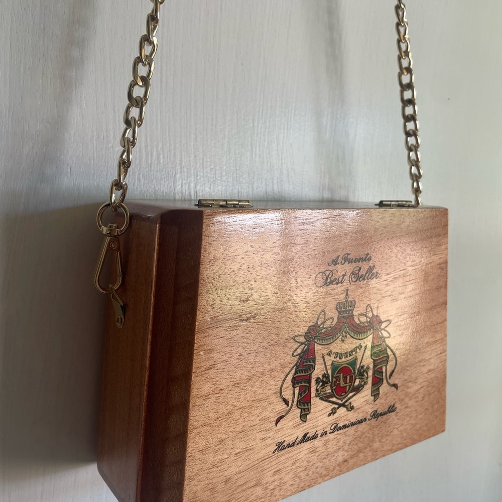 Arturo Fuente Cigar Box purse with gold chain.